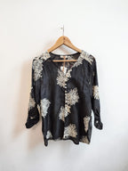 Blusa bordada manga aglobada